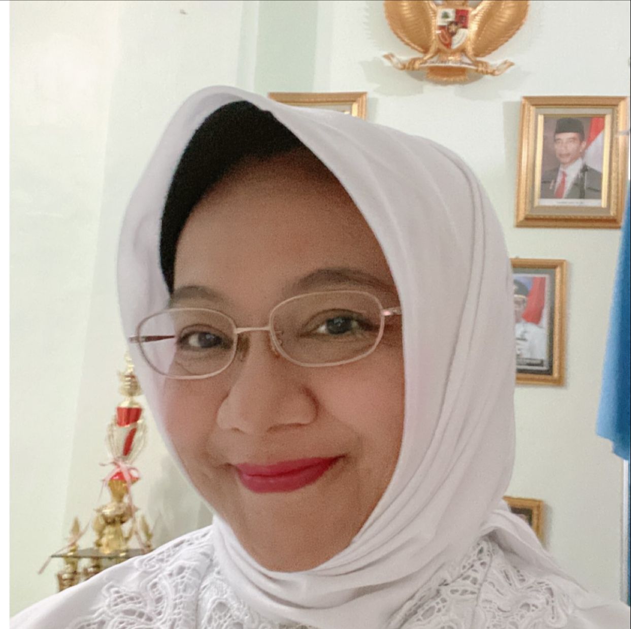 Dr. Hj. Dewi Suhartini, M.Pd
